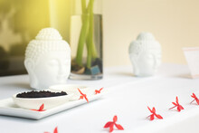Spa Composition With Exotic Flowers And Buddha Head Statues