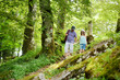 © MNStudio - Father and daughter following a footpath around La Verna Sanctuary, Chiusi della Verna, in Casentino secular forest, one of the largest forest in Europe. Foreste Casentinesi, Italy.