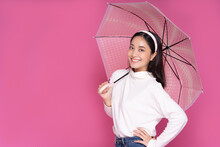 Portrait Asian Beautiful Happy Young Woman Smiling Cheerful And Holding Umbrella Isolated On Pink Studio Background