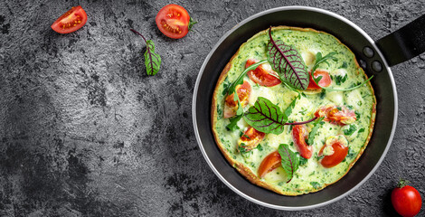 Frittata with fresh vegetables and cheese. Italian omelet in the pan. Keto, ketogenic lunch. banner, menu, recipe place for text, top view