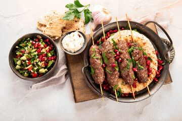 Wall Mural - Kebab with pita on light background.