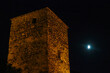 © Chris - Night view on Mestia with its beautiful illuminated Svan Towers in the High Caucasus, Svaneti Region in Georgia. The moon is shining on the tower, creating a a mysterious atmosphere. Travel. Rural.