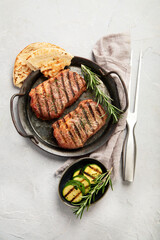 Wall Mural - Grilled steak on light background. Homemade food concept.