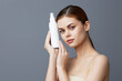 © SHOTPRIME STUDIO - beautiful woman skin care lotion with bare shoulders Gray background