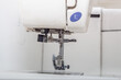 Overlock sewing machine platform and needle. Making clothes, sewing.
