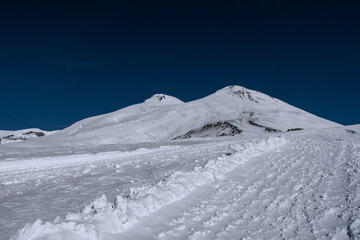 Wall Mural - Amazing snowy mountain landscape of the Caucasus, peaks of mount Elbrus on a clear blue sky day