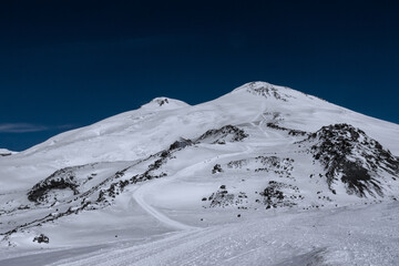 Wall Mural - Amazing snowy mountain landscape of the Caucasus, peaks of mount Elbrus on a clear blue sky day