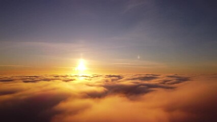 Poster - Flying high over the clouds. Aerial footage above the clouds of drone flying sideways and rotating camera smoothly to left