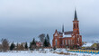 Catholic church of St. Anthony of Padua in Pastavy in winter. Monument of architecture in the neo-Gothic style.
