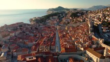 Amazing Panoramic Sunset Drone View Of Old City Of Dubrovnik, Croatia. View Of The Historical Center And Main Street Named Stradun In The Sunset Rays.