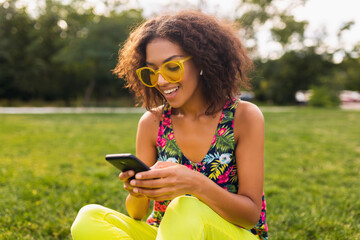 Wall Mural - young stylish black woman having fun in park summer fashion style