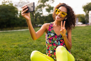 Wall Mural - young stylish black woman having fun in park summer fashion style