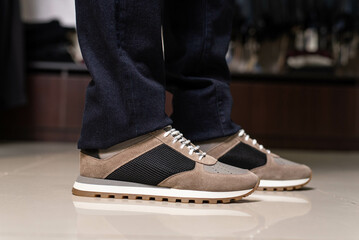 suede leather men's sneakers are worn on the foot