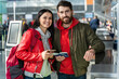 © NFstock - We are ready. Horizontal view of the overjoyed wife and husband rejoicing of the future travel. They holding passports and tickets and looking at the camera