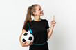 © luismolinero - Young football player woman isolated on white background pointing up a great idea