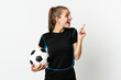 © luismolinero - Young football player woman isolated on white background intending to realizes the solution while lifting a finger up