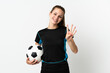 © luismolinero - Young football player woman isolated on white background happy and counting four with fingers