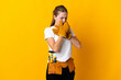 © luismolinero - Young electrician woman isolated on yellow background is suffering with cough and feeling bad
