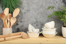 Empty Rustic Table With Wooden Cutlery, Crockery And Palm Leaves. Kitchen Interior, Mockup For Design And Product Demonstration, Zero Waste Concept, Selective Focus