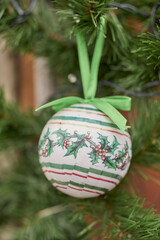 Wall Mural - An decorational Christmas bauble hanging on a t