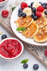 Wall Mural - Keto diet pancakes made or almond flour, served with berries.