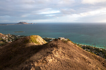 Canvas Print - Aerial sunrise at hike with mountains and ocean at the background, summer vacations for active people