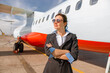 © Kostiantyn - Woman stewardess or air hostess standing outdoors at airport