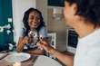 © Zamrznuti tonovi - African american couple drinking white wine and having dinner at home
