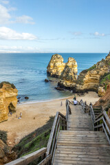 Poster - Wooden stairs lead to the Camile  and Boneka beach in Lagos, Portugal