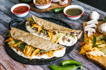 Poster - Mexican chicharrón quesadilla with oaxaca cheese and squash blossom, traditional food from the city of Puebla in Mexico