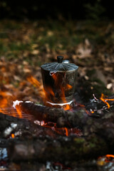 Wall Mural - Steaming moka pot on campfire. Bushcraft