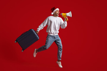 Xmas Tours. Guy In Santa Hat Holding Suitcase, Making Announcement With Loudspeaker