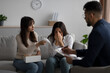 © Prostock-studio - LGBT lesbian couple consulting phychologist. Middle eastern woman crying, her gay partner comforting her