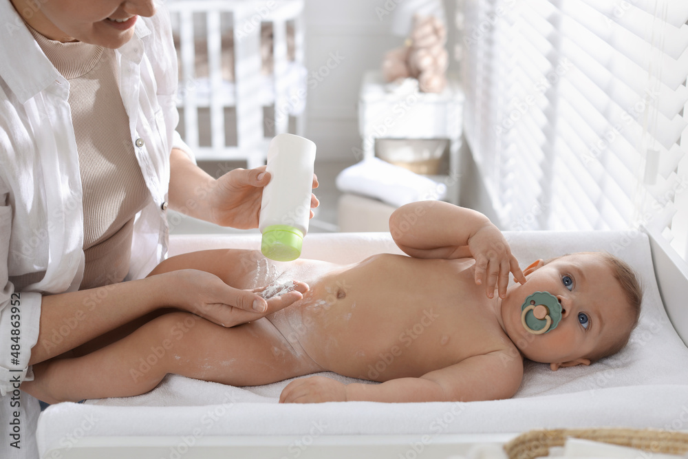 Mother applying dusting powder on her cute baby at home, closeup Stock ...