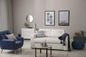 Poster - Stylish living room interior with white sofa, armchair and small coffee table