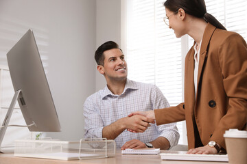 Poster - Employee shaking hands with intern in office