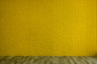 © New Africa - Empty room with yellow brick wall and wooden floor