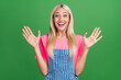 Photo of crazy excited cute charming lady sale wow reaction raise hands wear striped overall isolated green color background