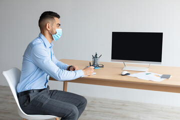 Aufkleber - Arab Worker In Facemask Using Laptop With Empty Screen, Mockup