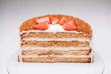 homemade honey cake decorated with strawberry slices