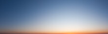 Clear Blue Sky In Evening With Bright Sunset Panorama