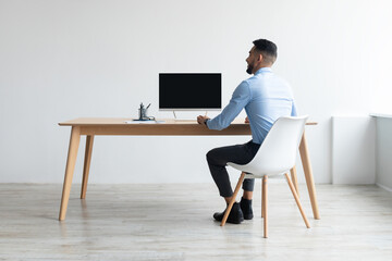 Poster - Arab man looking at blank empty computer monitor