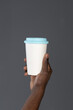 © Svyatoslav Lypynskyy - African man hand with cardboard cup or disposable cup for coffee or tea. White disposable cup with blue plastic lead in mans hand. Disposable dishes concept
