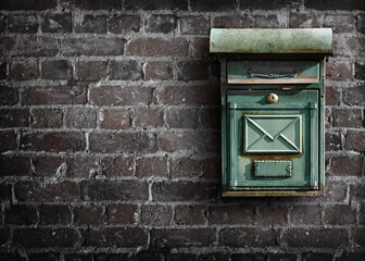 Mailbox on an old brick wall. Bricks wall with mailbox.