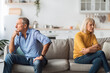 © Prostock-studio - Unhappy Mature Spouses After Quarrel Sitting Back-To-Back At Home