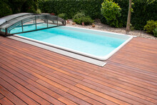 Outdoor Swimming Pool With Cover Enclosure And Teak Wood Deck