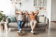 © Prostock-studio - Happy Senior Couple Relaxing Sitting On Sofa At Home