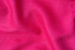 wrinkled pink fabric texture background close up