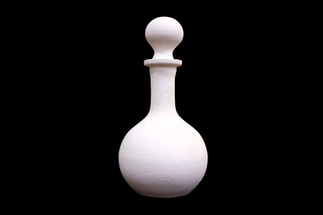 white plaster jug isolated on a black background