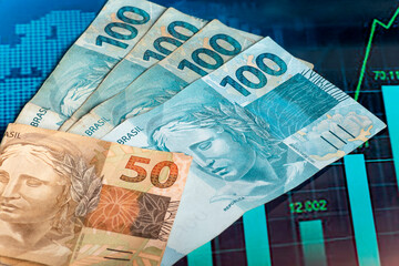 Wall Mural - Brazilian money over a chart, economy concept